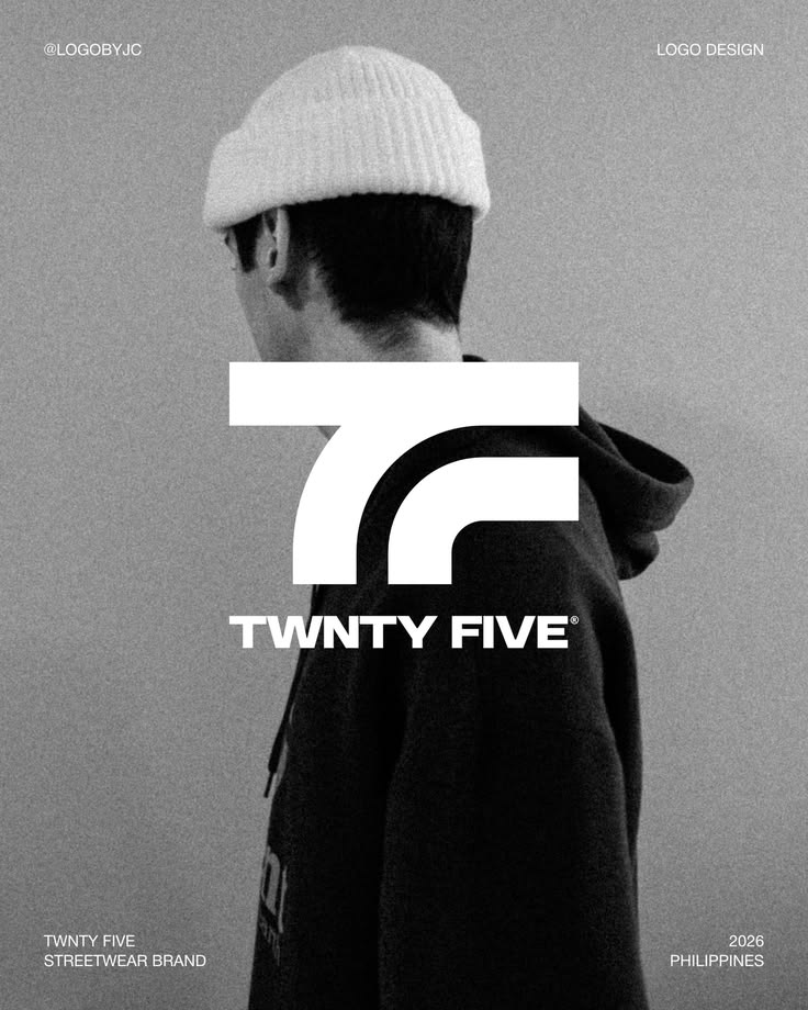 Photo of a man wearing a hat with a logo on the front