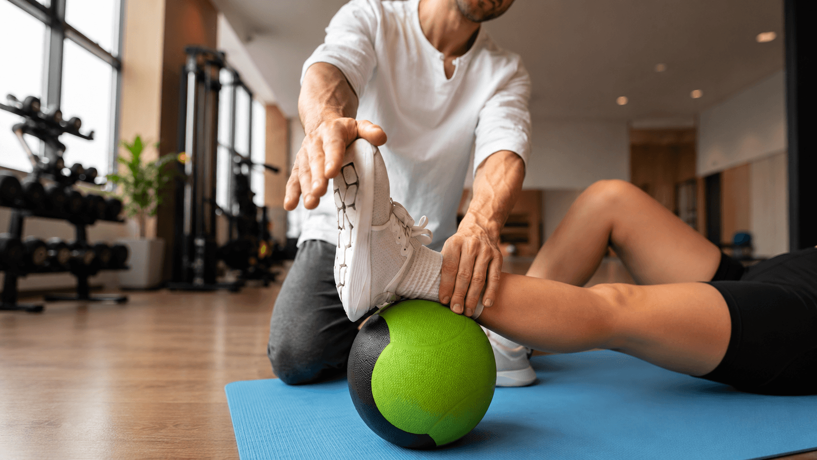 Woman practicing corrective exercise therapy under expert supervision to restore strength and movement quality at Ember & Ice Health.