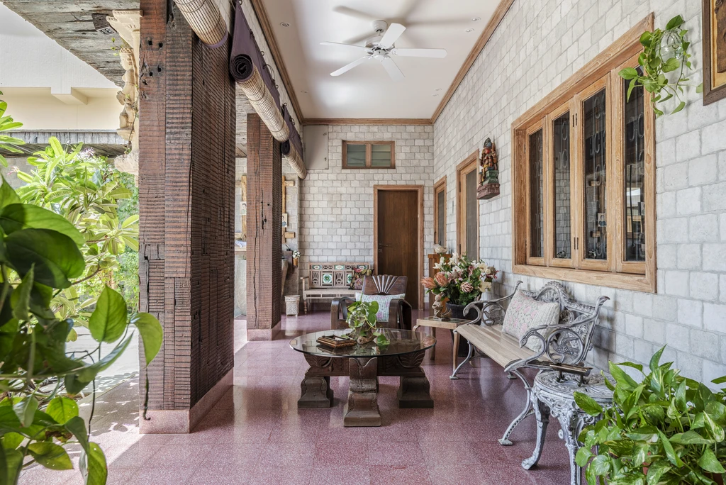 a living room filled with furniture and a mirror