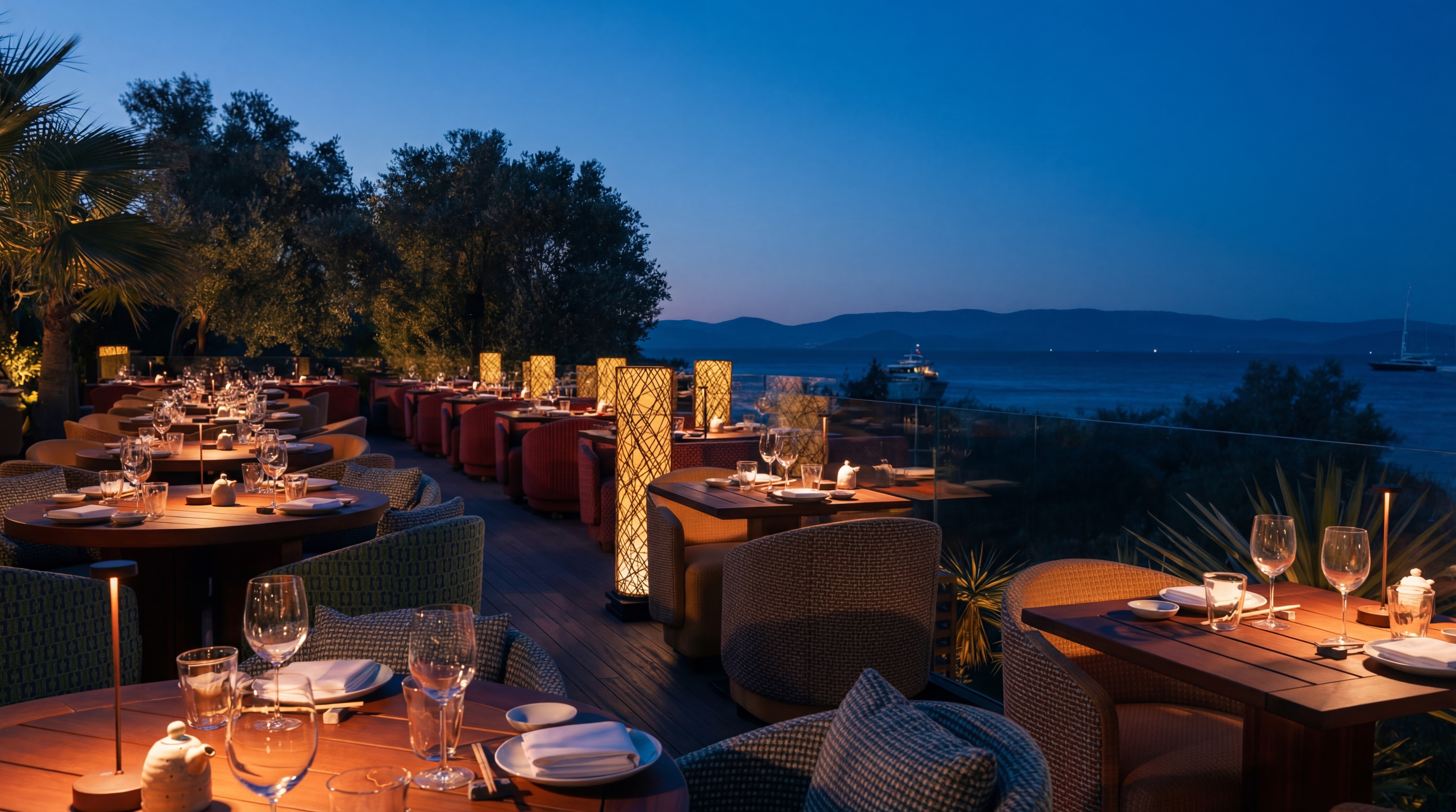 Roka restaurant terrace at Mandarin Oriental Bodrum at night with sea views and candlelit dining