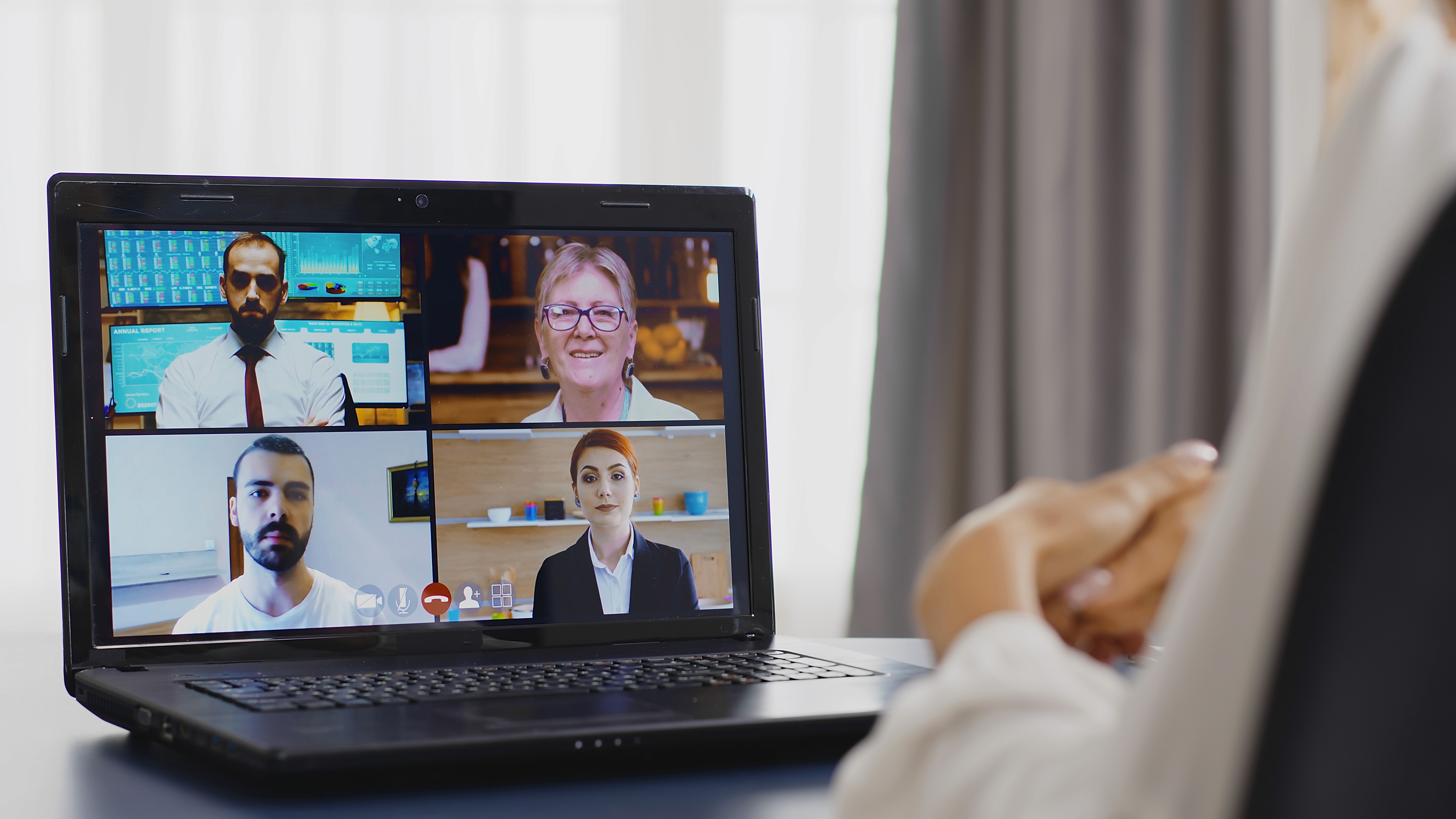 group of 4 people having in depth interviews online in front of the interviewer