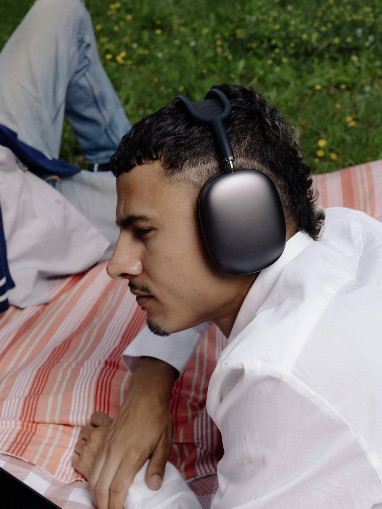A man listening through headphones.