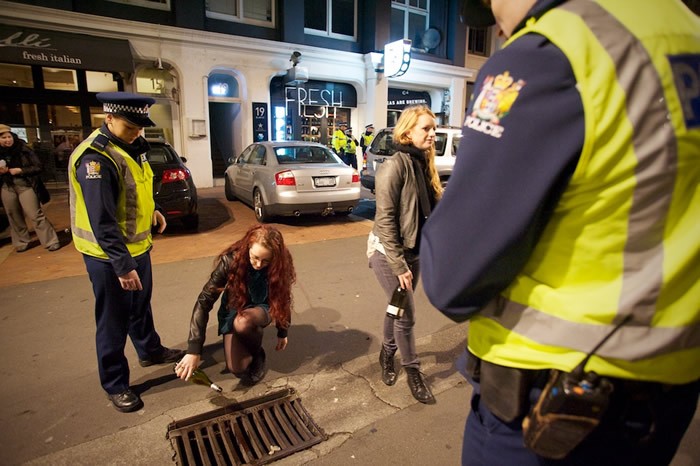 woman showing left hand with wedding band