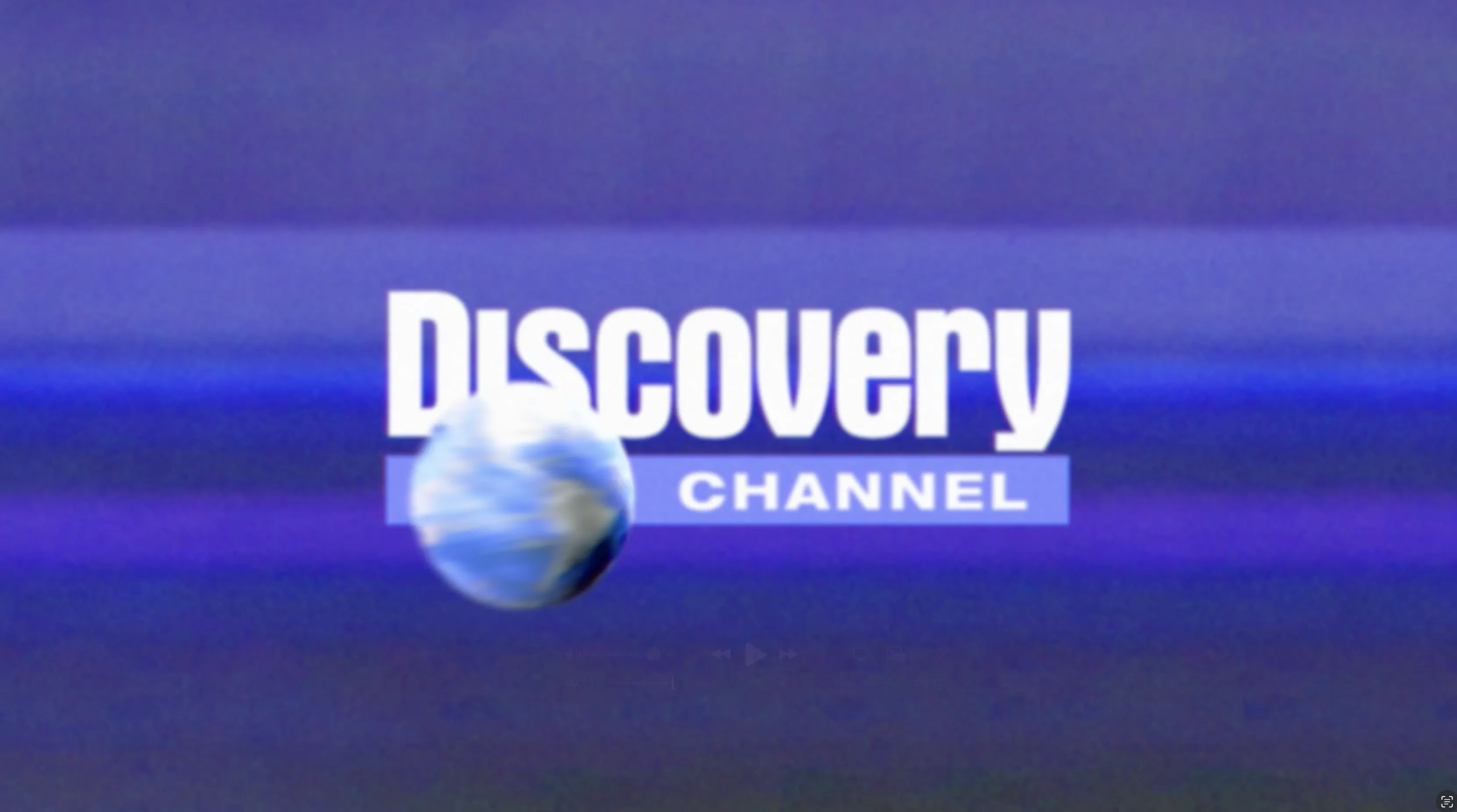 Discovery Channel logo on a purple abstract background. A small spinning globe moves across the frame in front of bold white text.