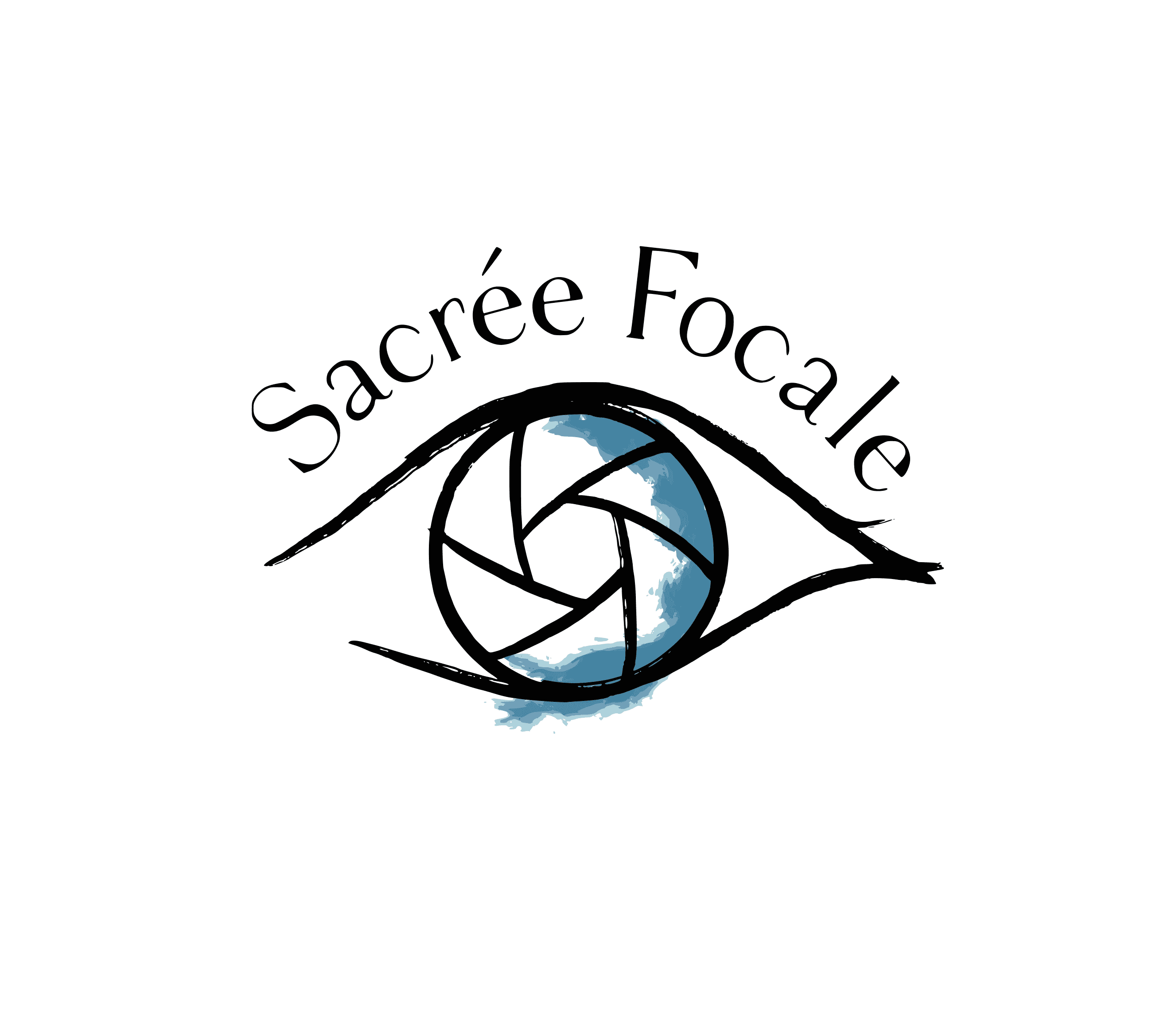 A large, striped hot air balloon flies low over rocky hills and unusual rock formations under a clear blue sky. A second balloon is visible in the distance.