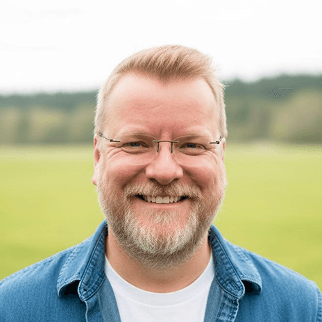 portrait of tracy smiling with blue shirt outside