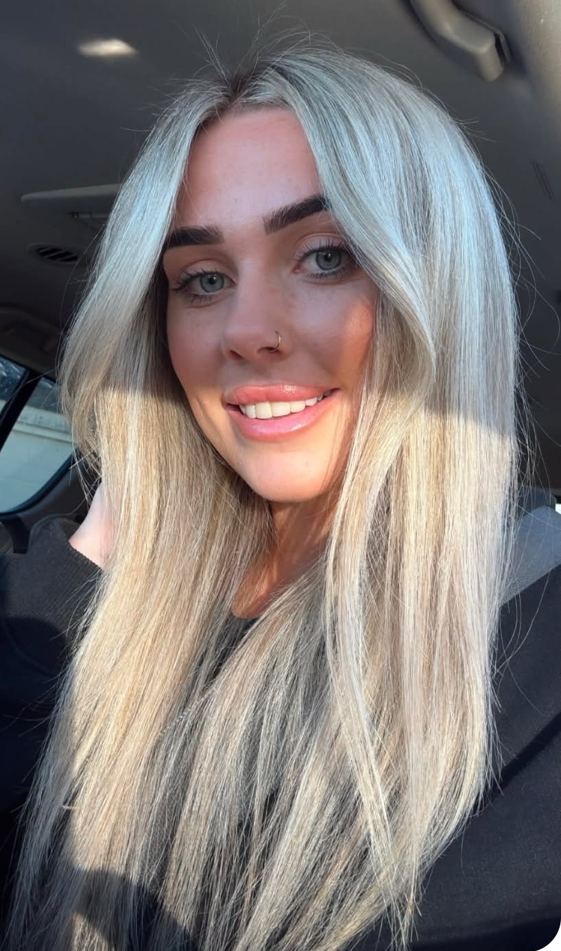 Steph, founder of S Luxury Locks, with long blonde hair.