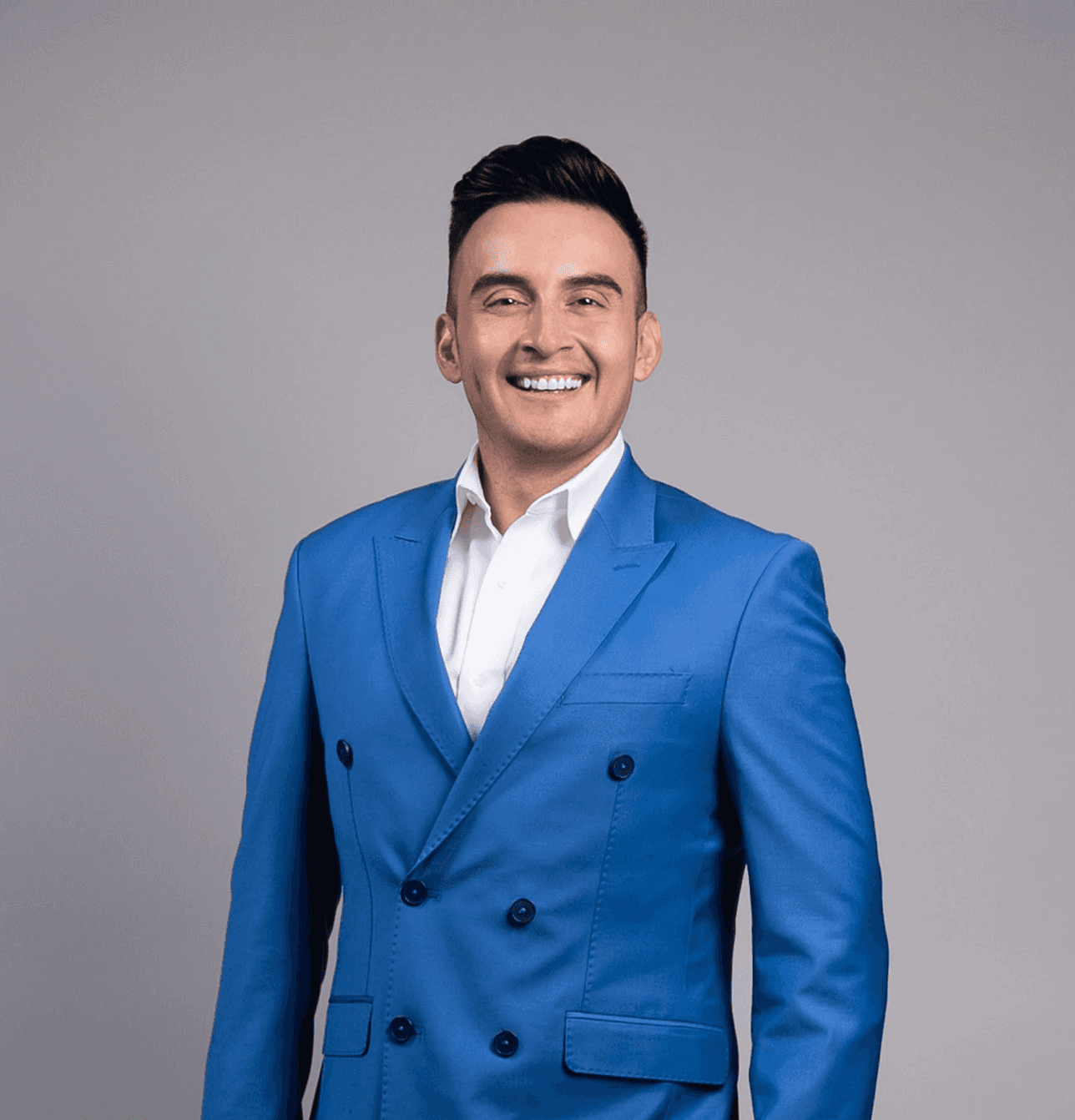 Black and white portrait of a smiling person with curly hair