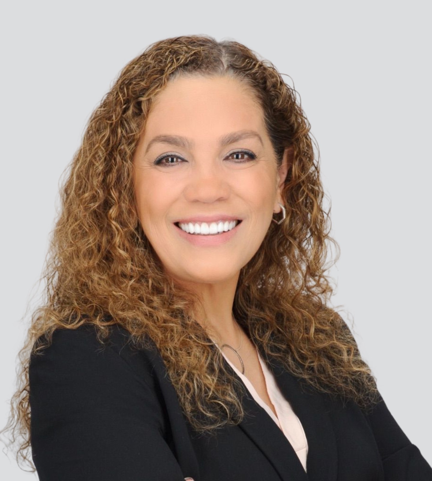 smiling woman wearing white and black pinstriped collared top