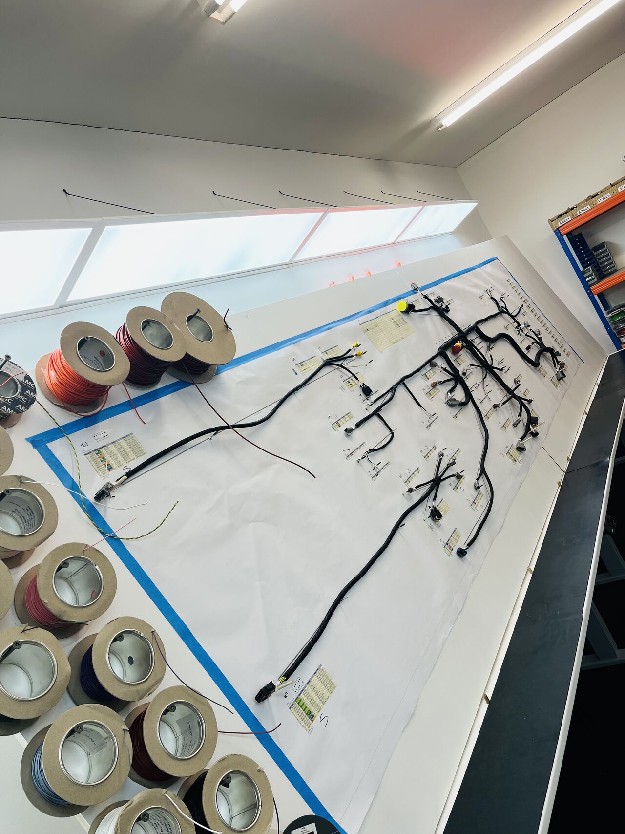 A small airplane flying through a blue sky