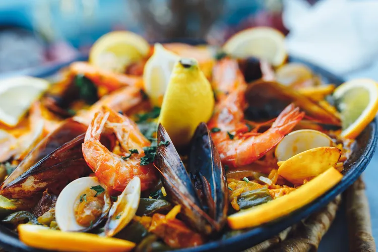 Seafood paella with shrimp, mussels, clams, and lemon at Conch House.
