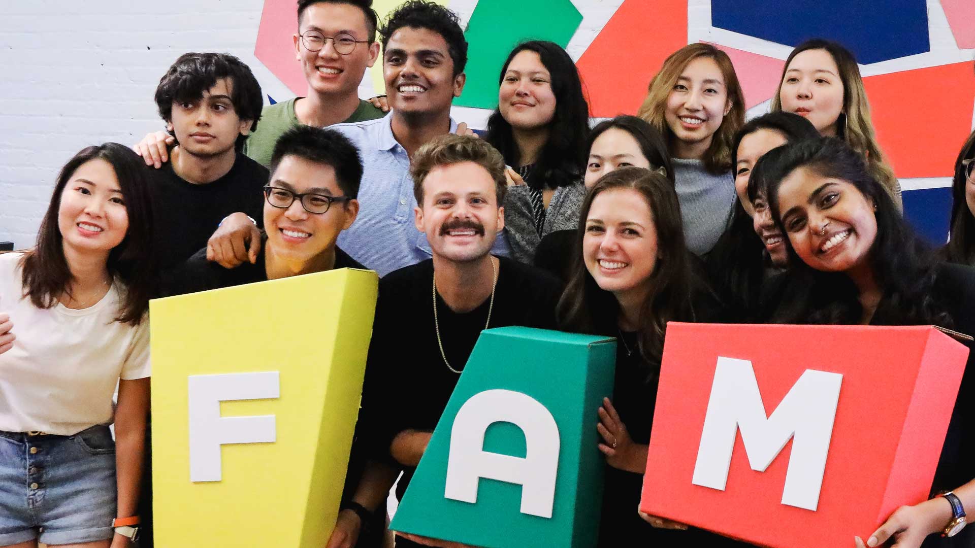 MFA Design students holding FAM