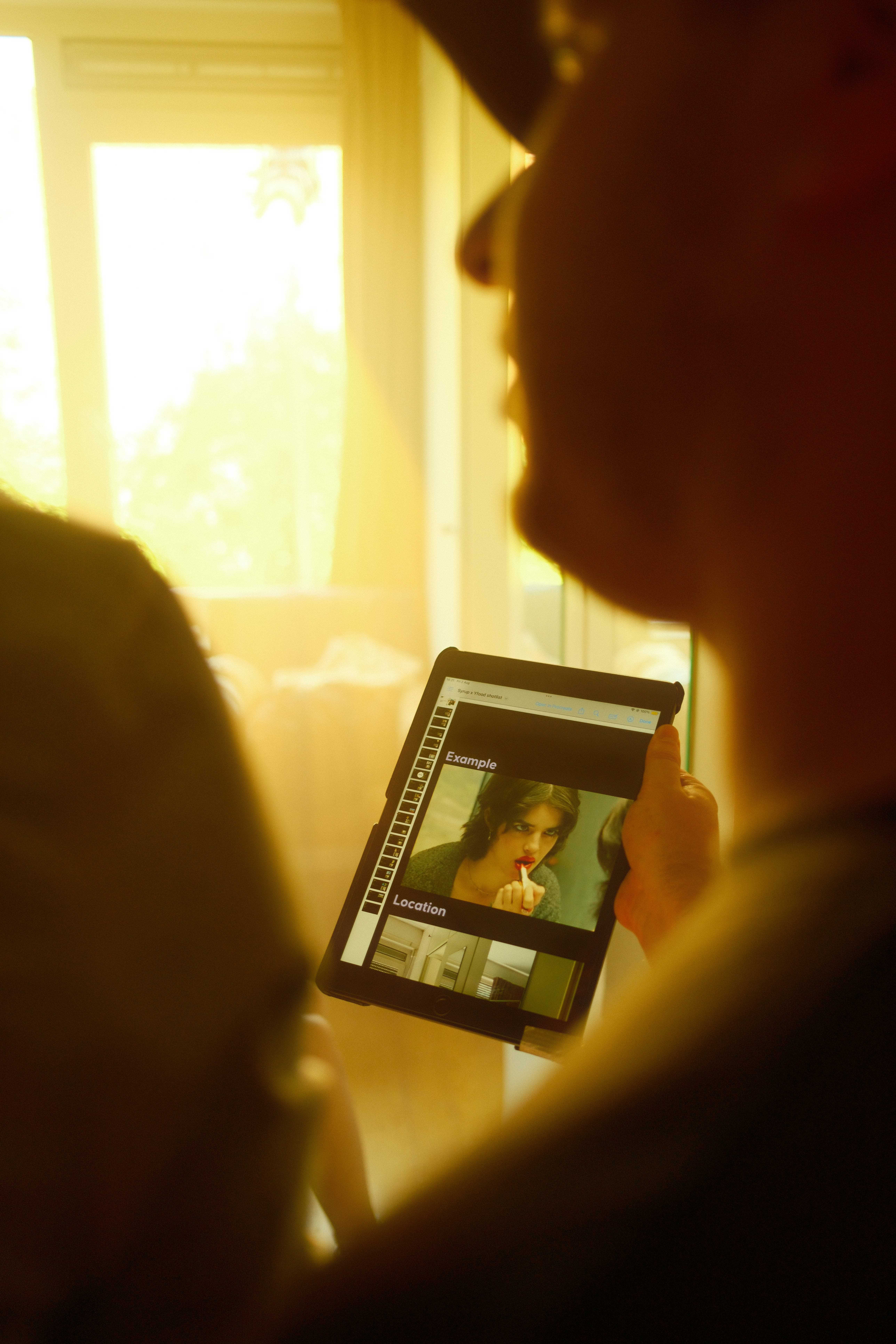 Streetside billboard with flyposters of the Batch.Works brand and illustrations