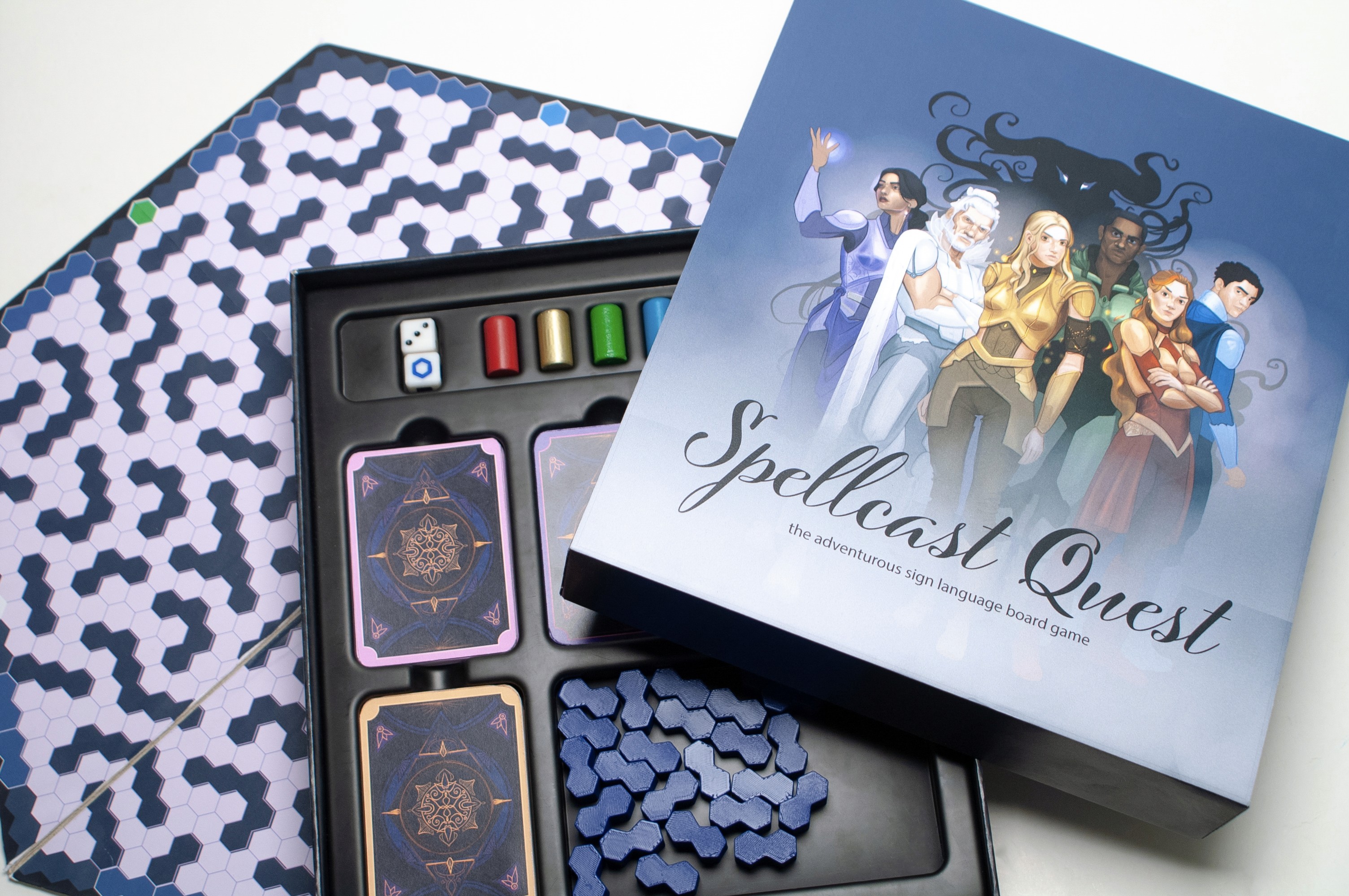 Prototype packaging and components for Spellcast Quest, a fantasy board game teaching sign language