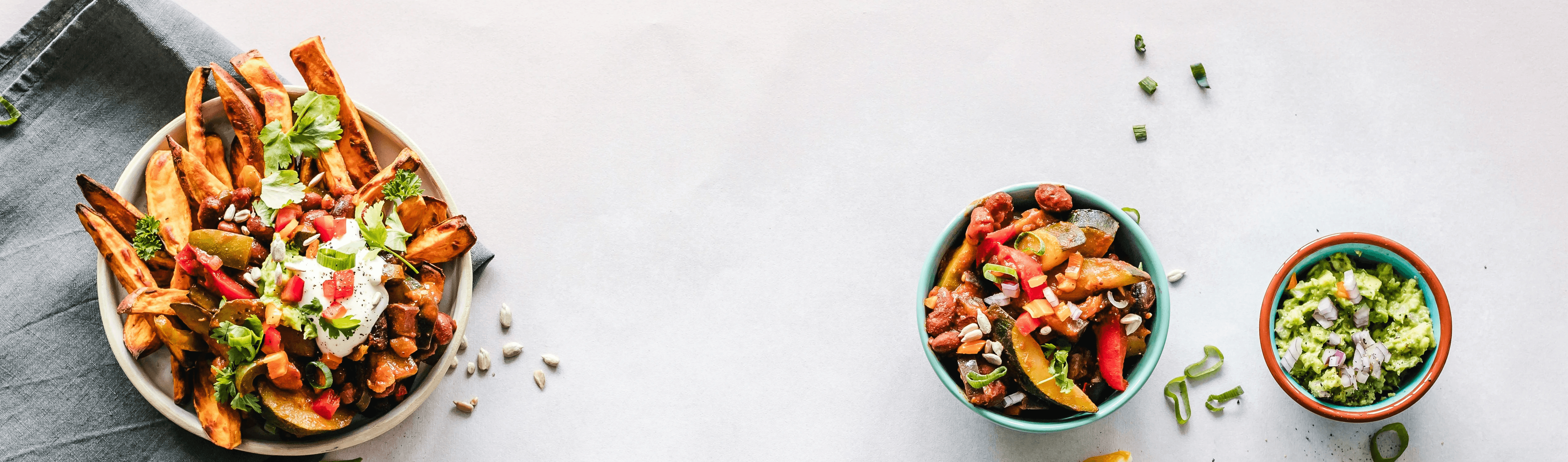 cooked dishes on plates and bowls