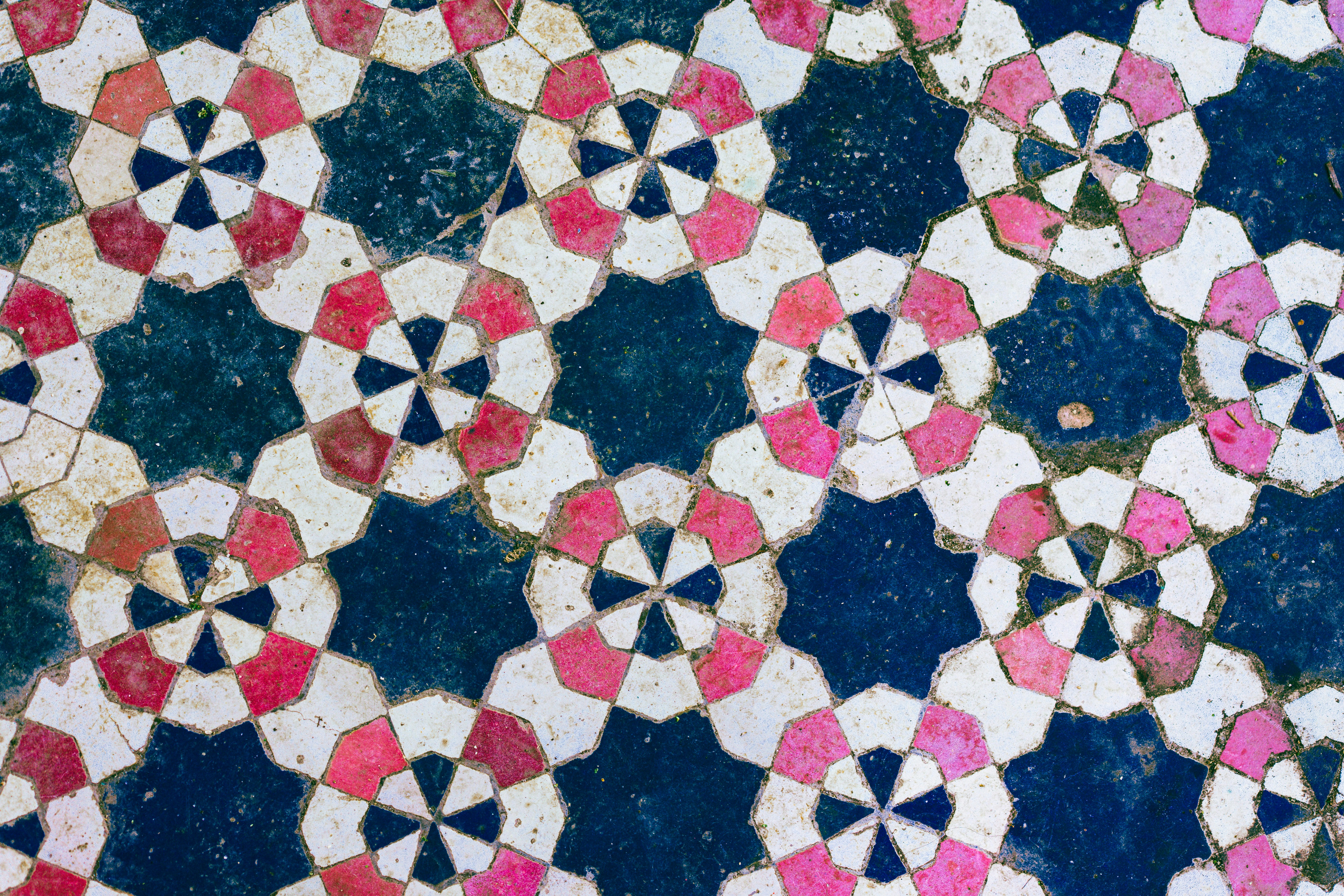 a close up of a colorful tile design