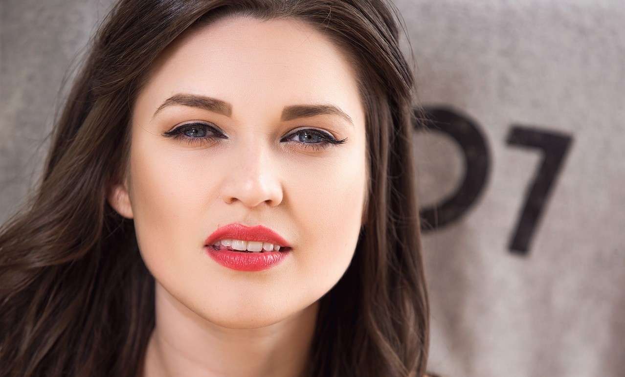 kids lying on a glass land and smiling