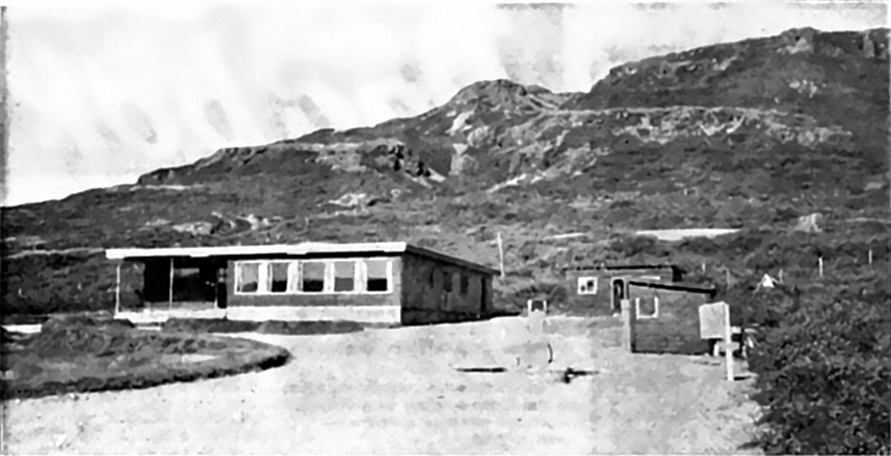Hótel Flókalundur, a low timber building beneath the mountainside in Vatnsfjörður, newly built in 1968