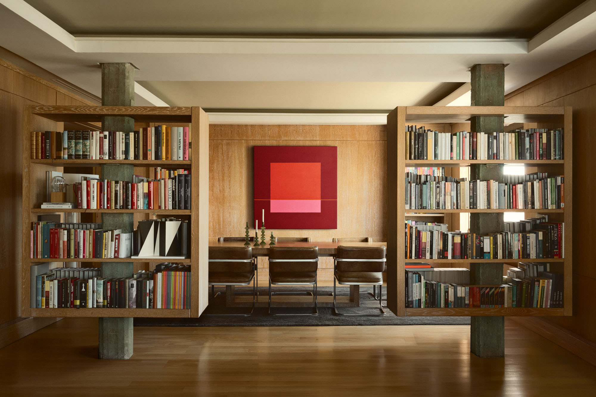 Open-plan living space with bespoke bookshelves in Bea Bonilla’s home.