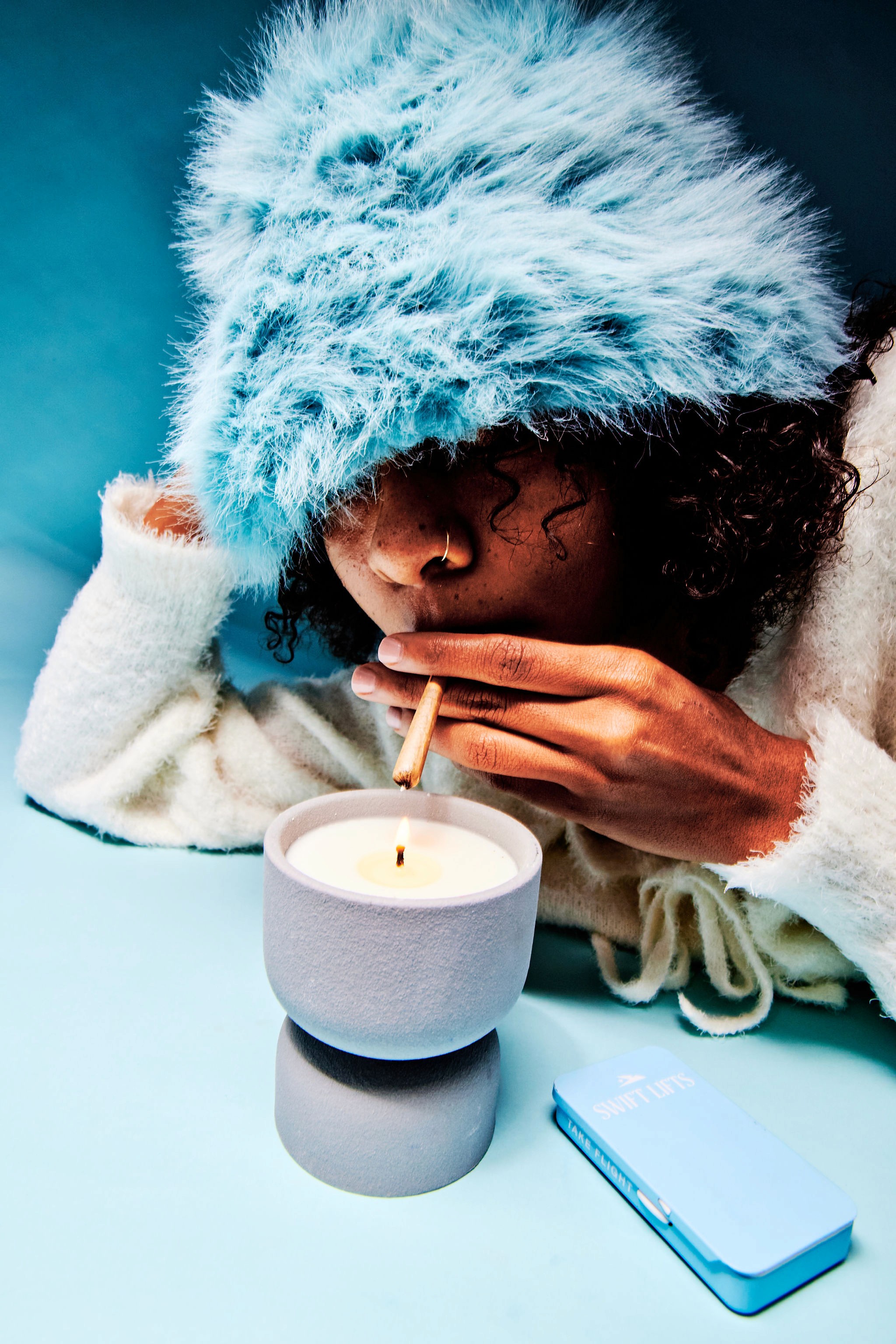Woman with red hair covering mouth with hair