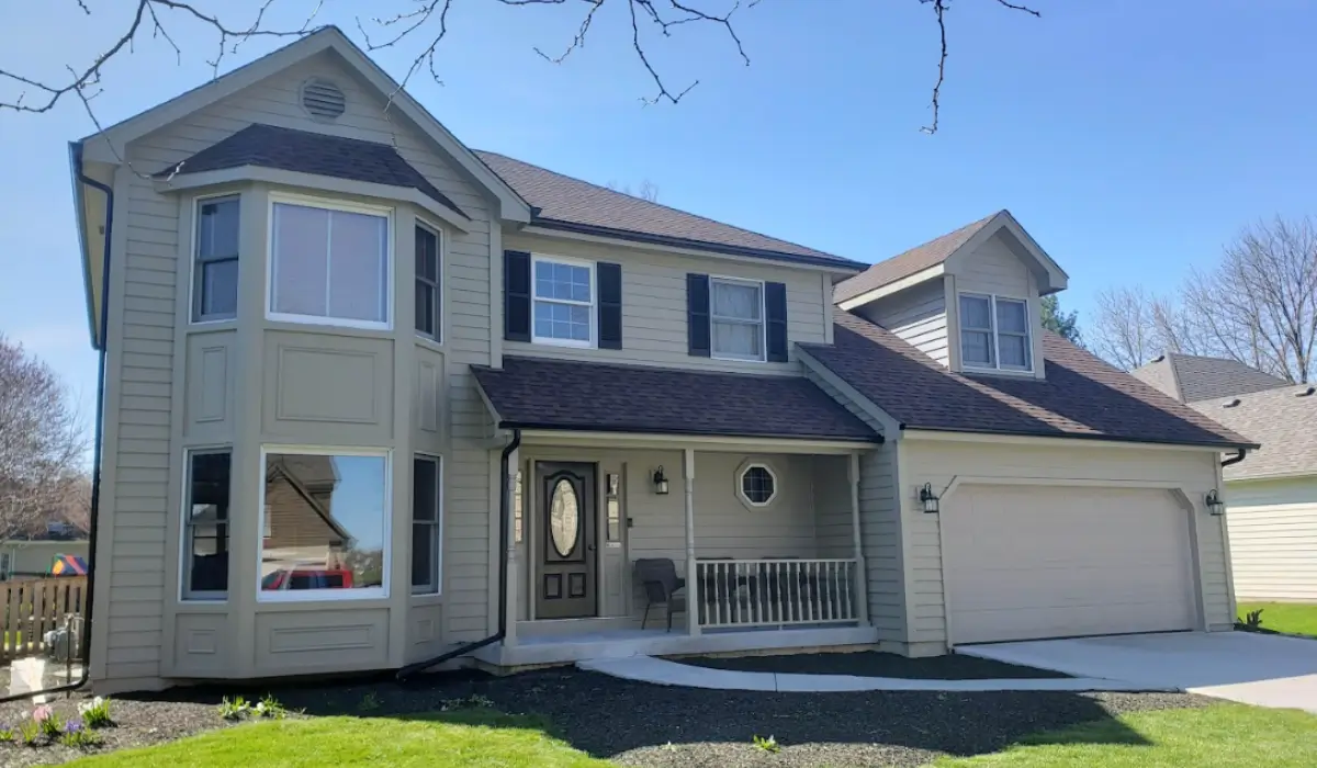 Modern home featuring roofing and siding projects completed before spring real estate listing in Illinois market.
