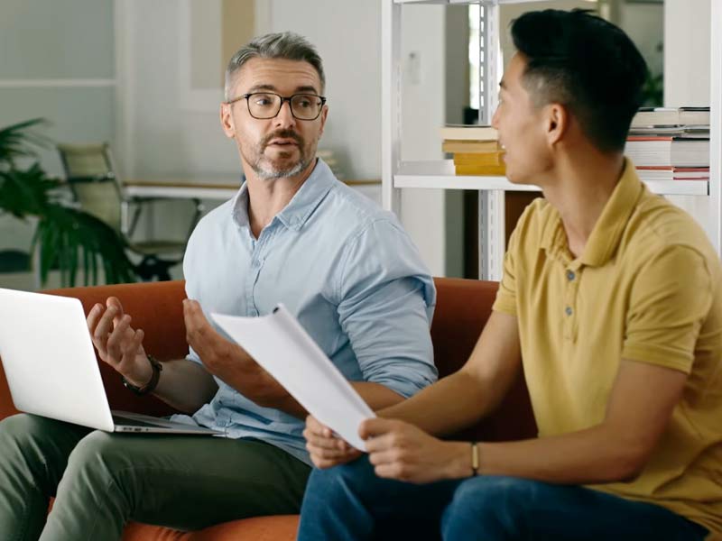 person sitting front of laptop