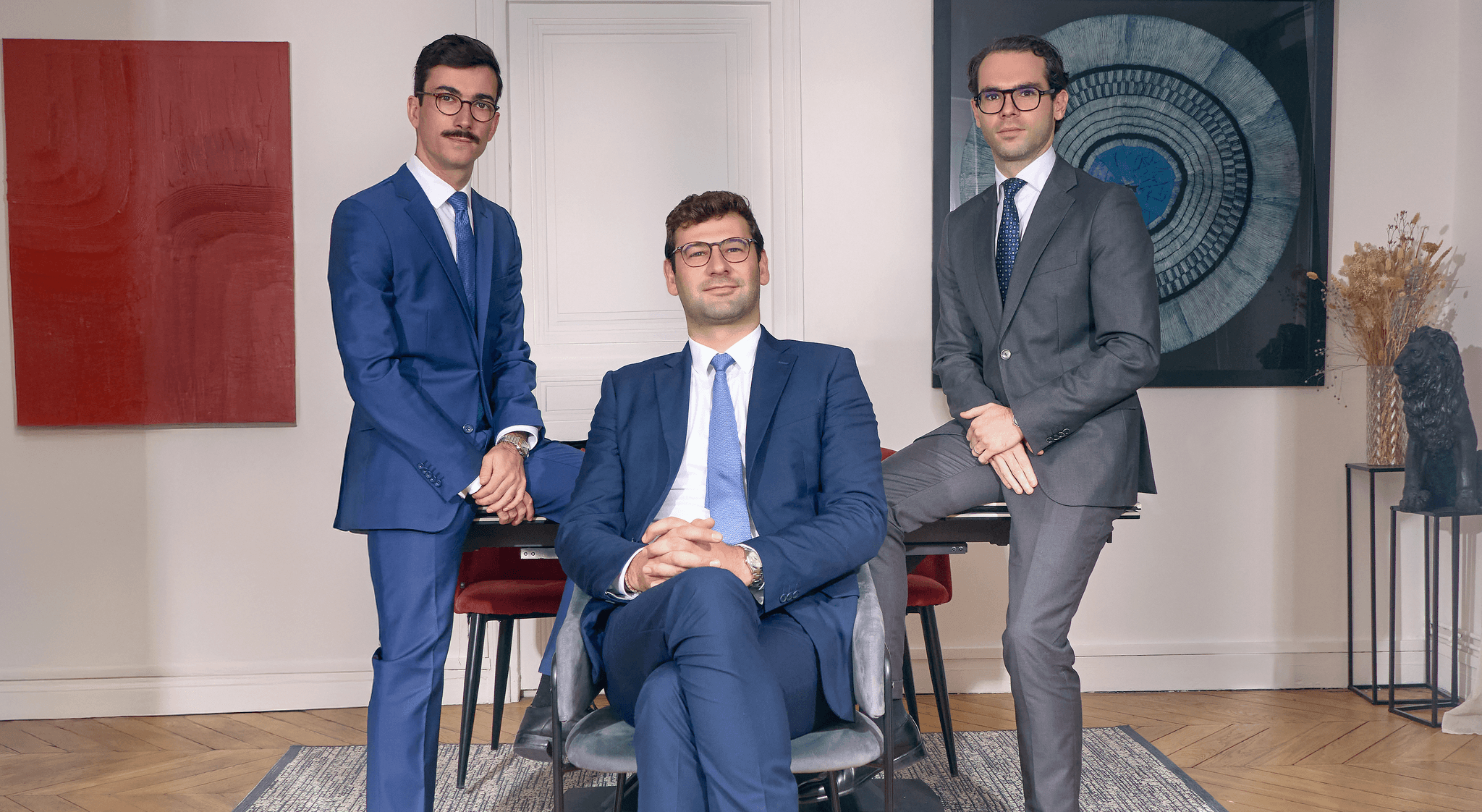 woman sitting around table holding tablet