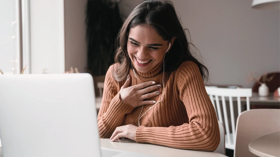 person on video call using laptop