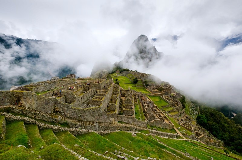 Machu Picchu ruins covered by soft clouds