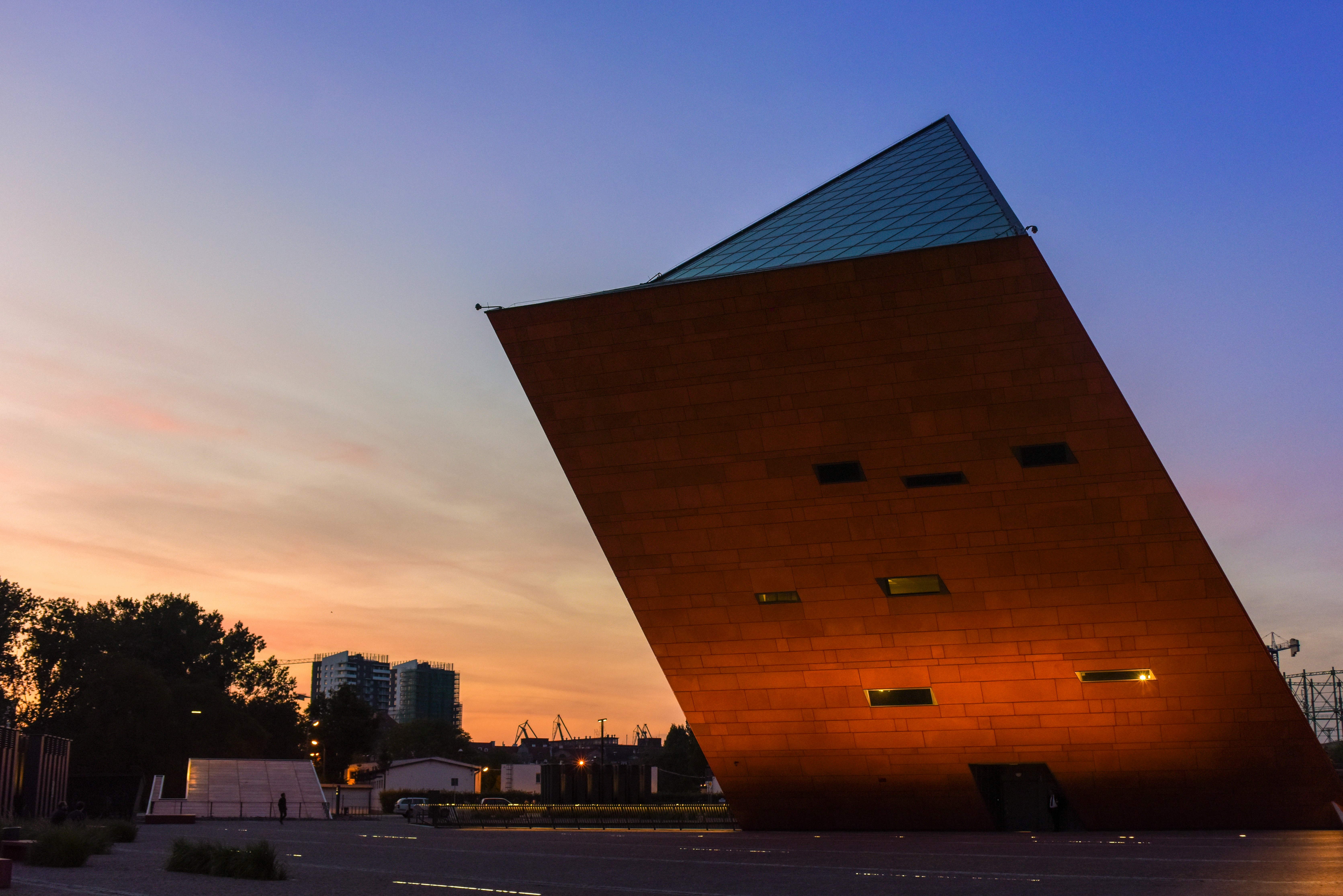a tall building sitting on the side of a road