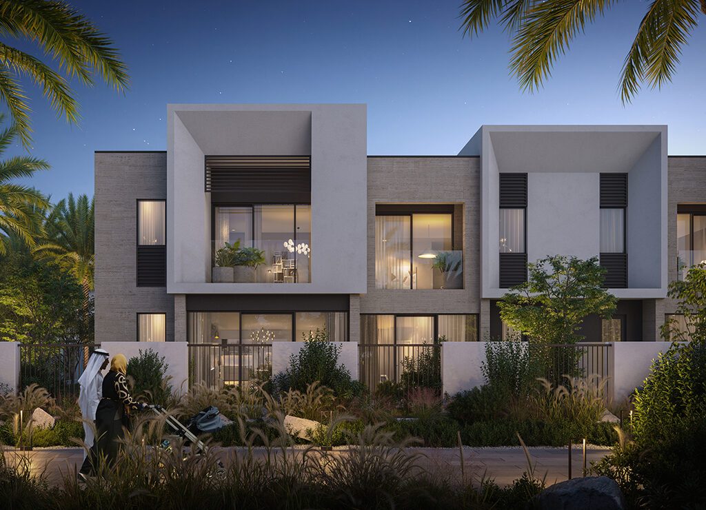 A nighttime view of the villa in Anya 2, Dubai, featuring warm lighting that highlights its architectural beauty.