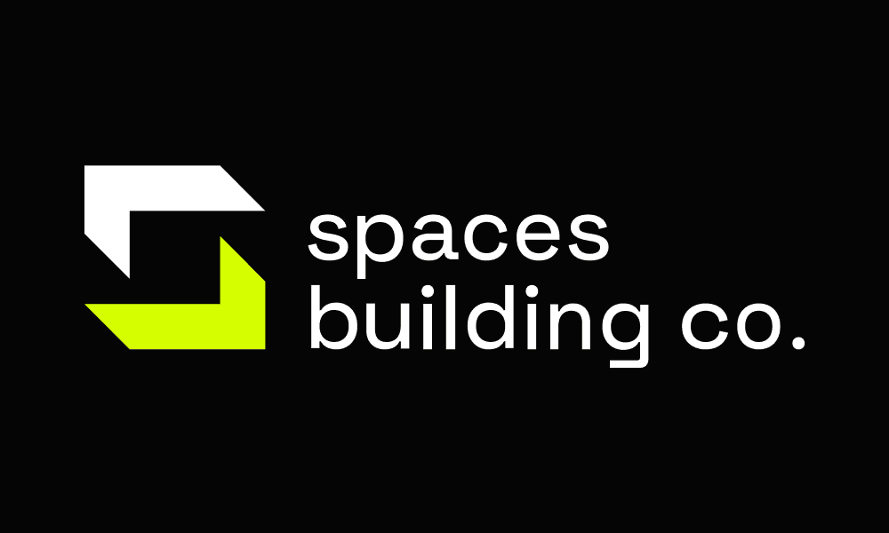 The Spaces Building Co. logo.