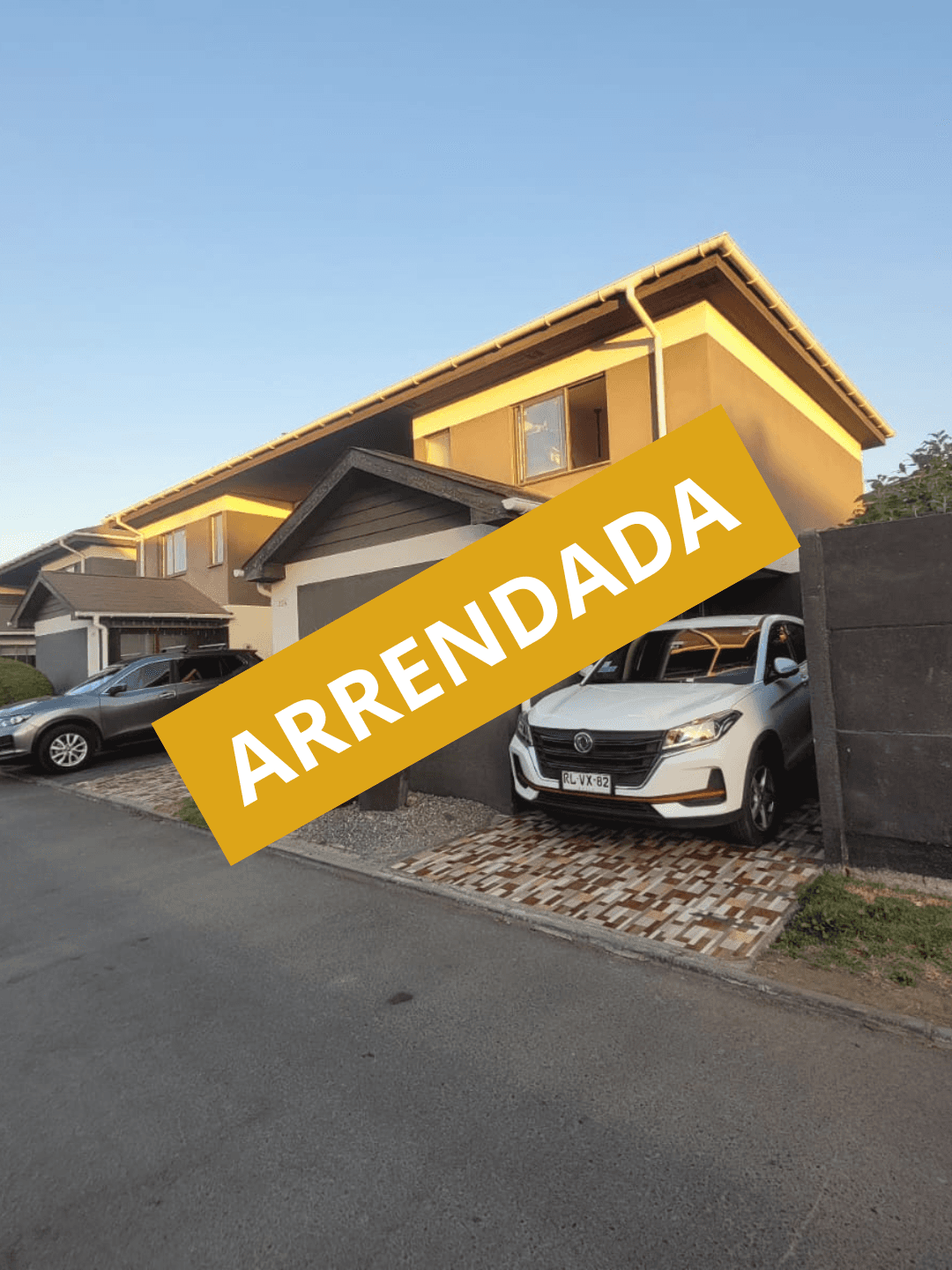Unique concrete and earth-covered building entrance in a dry, sunny landscape.