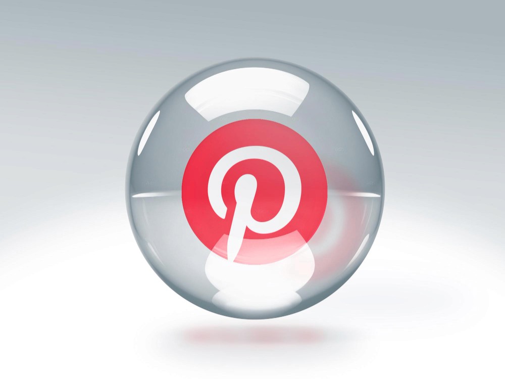 The Pinterest logo encapsulated within a transparent glass sphere, representing a fusion of technology and creativity.