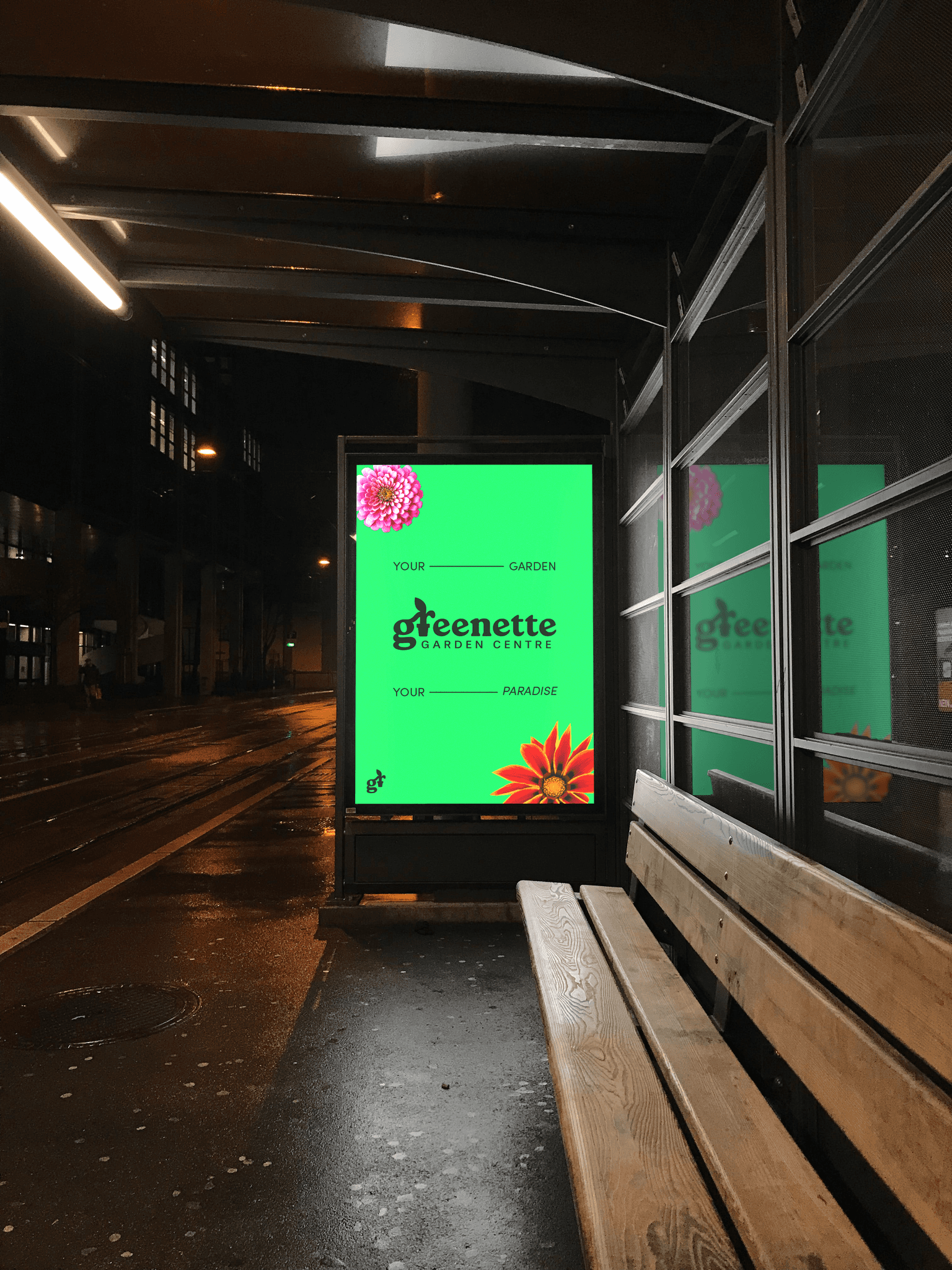 Digital screen at a bus stop with an advertisement for a garden centre