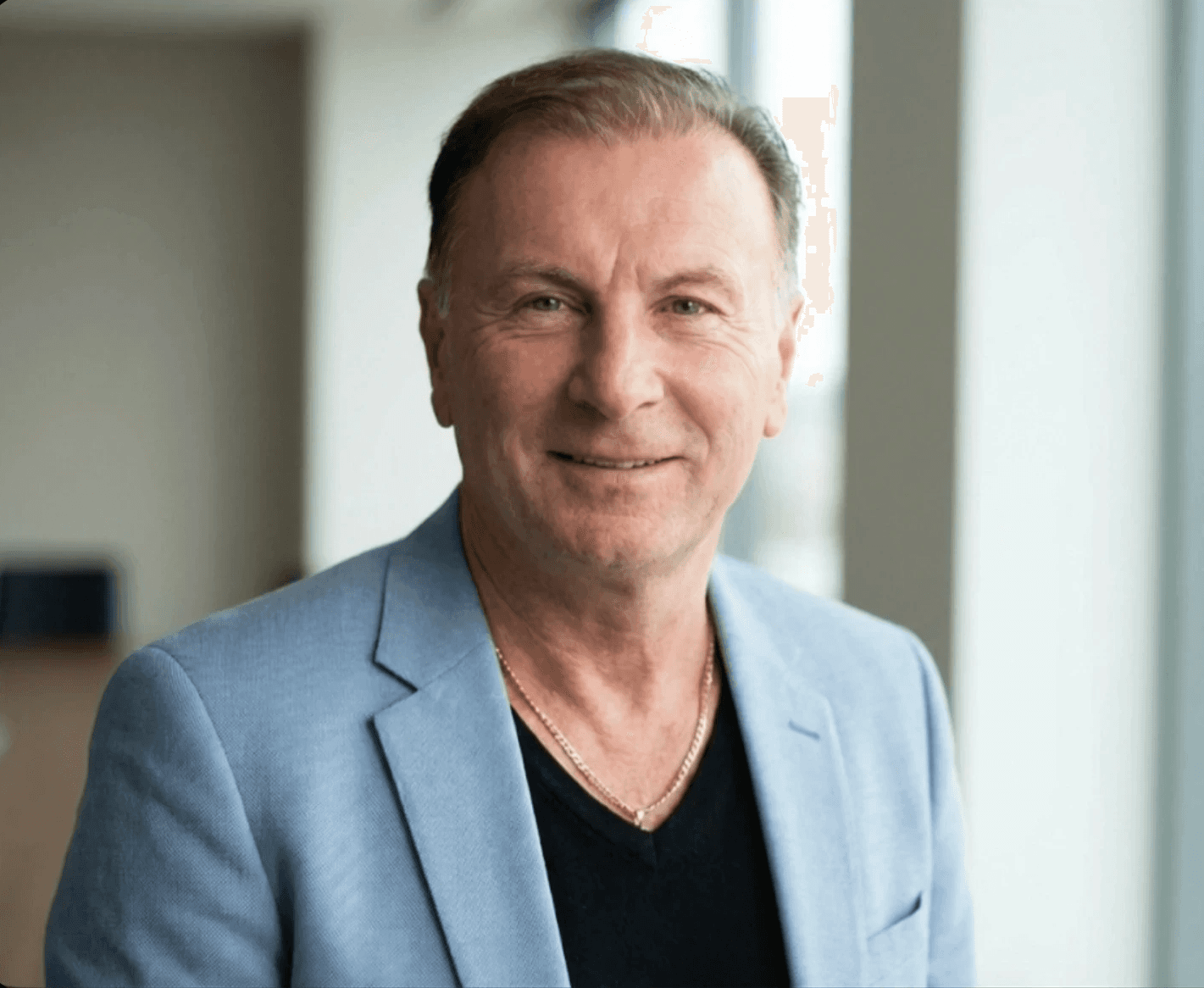 Man wearing red cap and top writing on a note pad