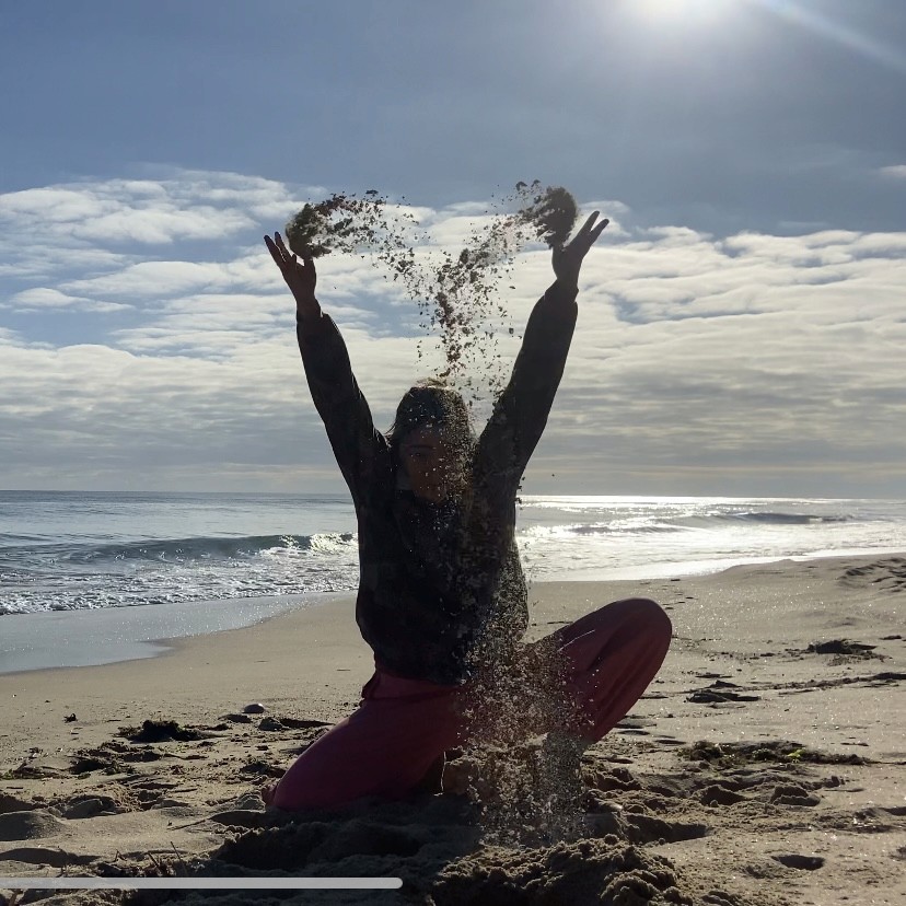 Sara is a client smiling to the camera happily