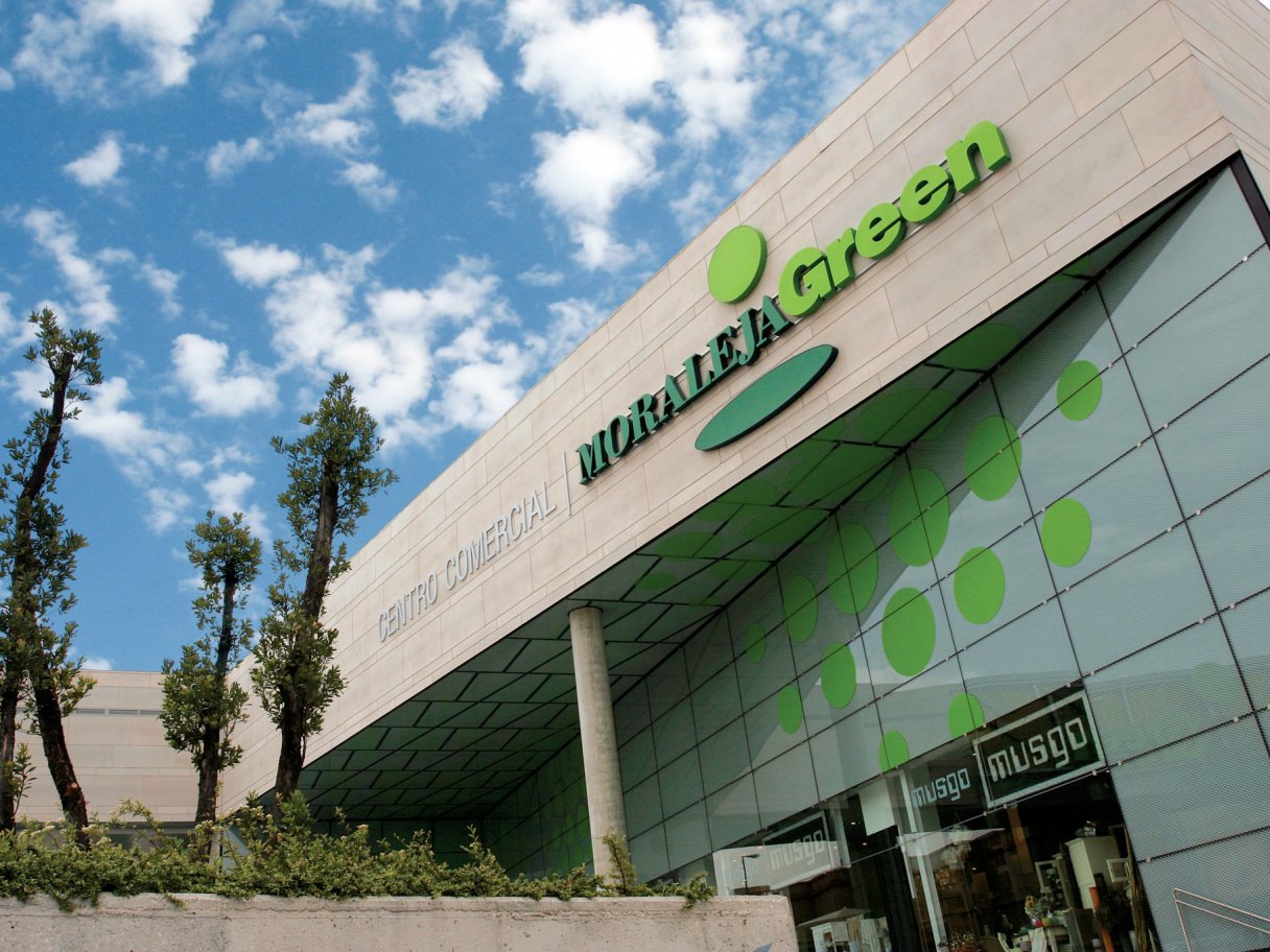 Rooftops of a coastal town with the sea in background