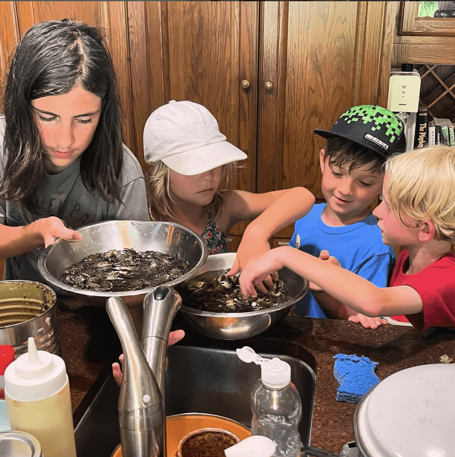 Kids cleaning crabs