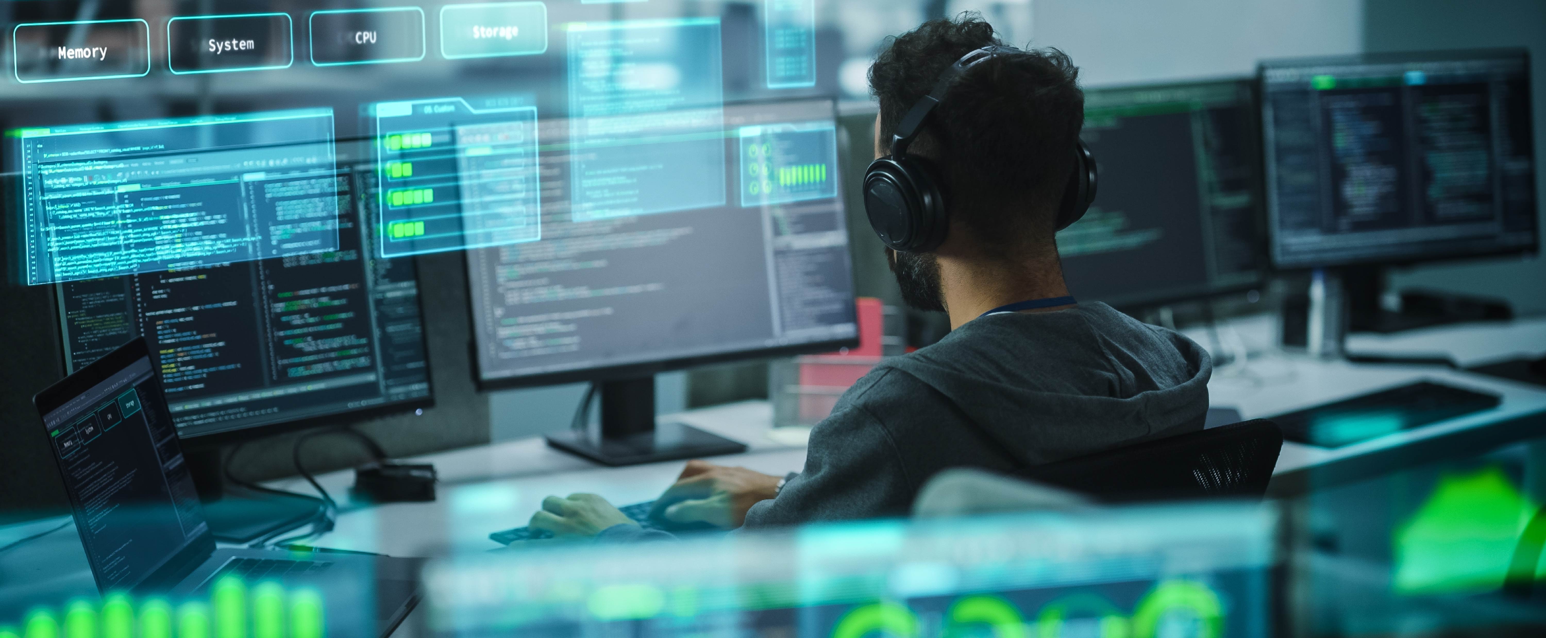 Lines of code and system architecture workflows displayed on dark monitors — Enterprise system integration by Brightgrove