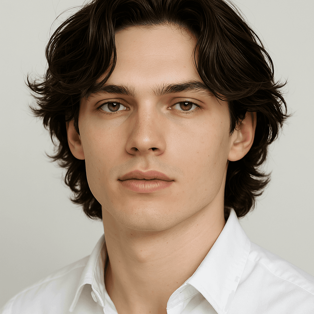 High-resolution portrait of a handsome young man with wavy dark hair and a calm expression, dressed in a crisp white shirt against a neutral background — perfect for showcasing a modern and professional look in a Framer agency template by Orbitx Supply