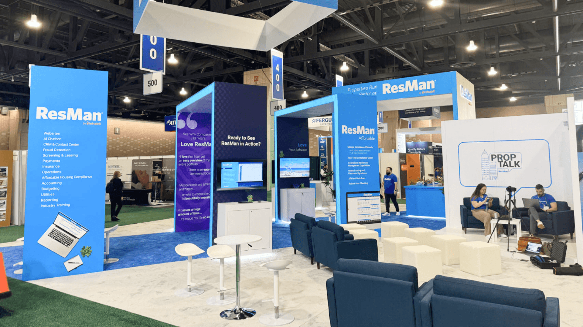 ResMan Apartmentalize 2024 demo stations with AV displays and clean cable-managed setup