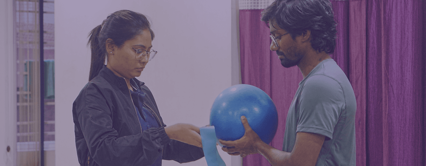 a woman holding a red handle while standing next to a man