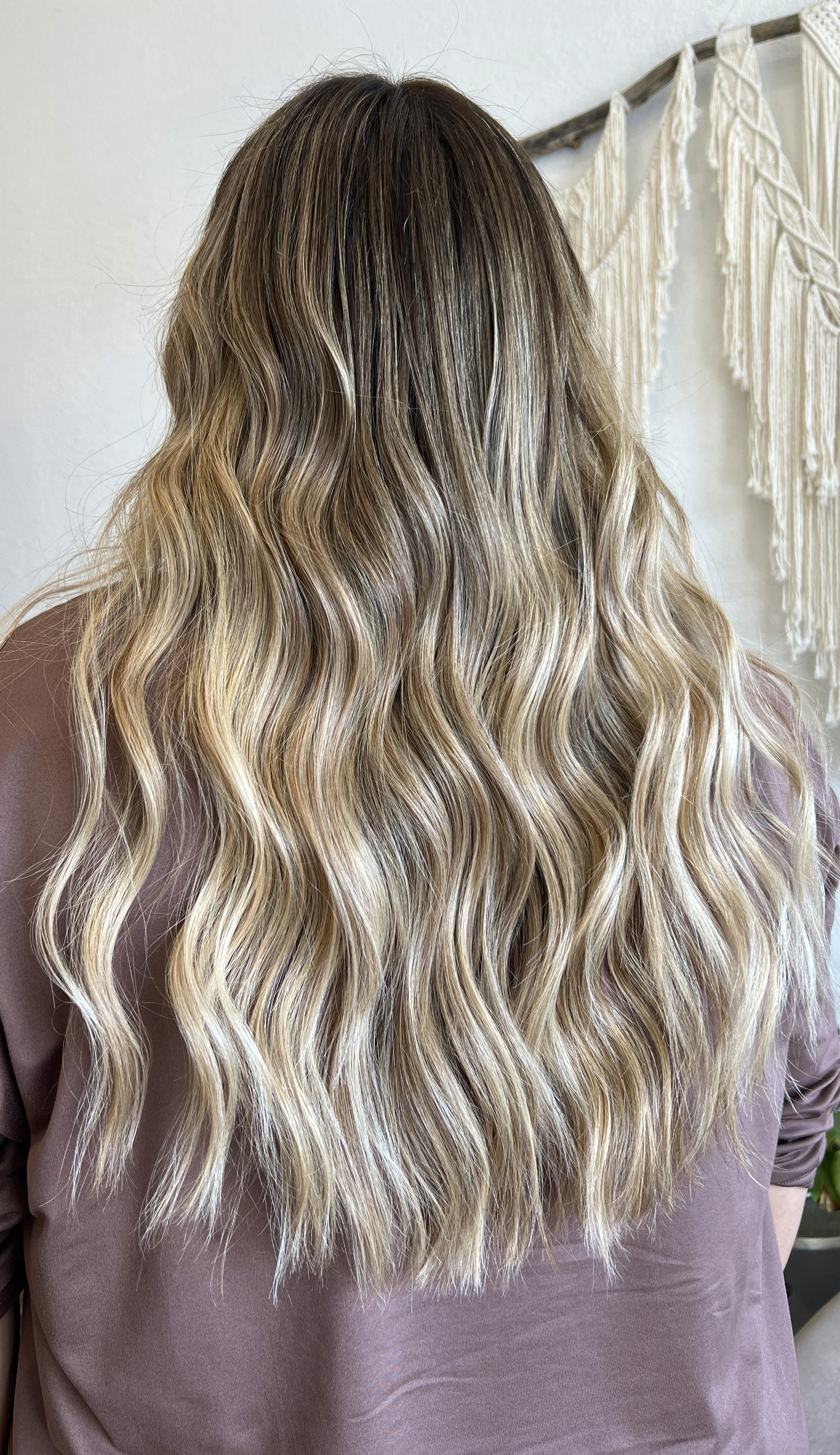 Lived-in blonde balayage with K-Tip extensions by Adriana Jackson at Del Sol Hair Studio Huntington Beach