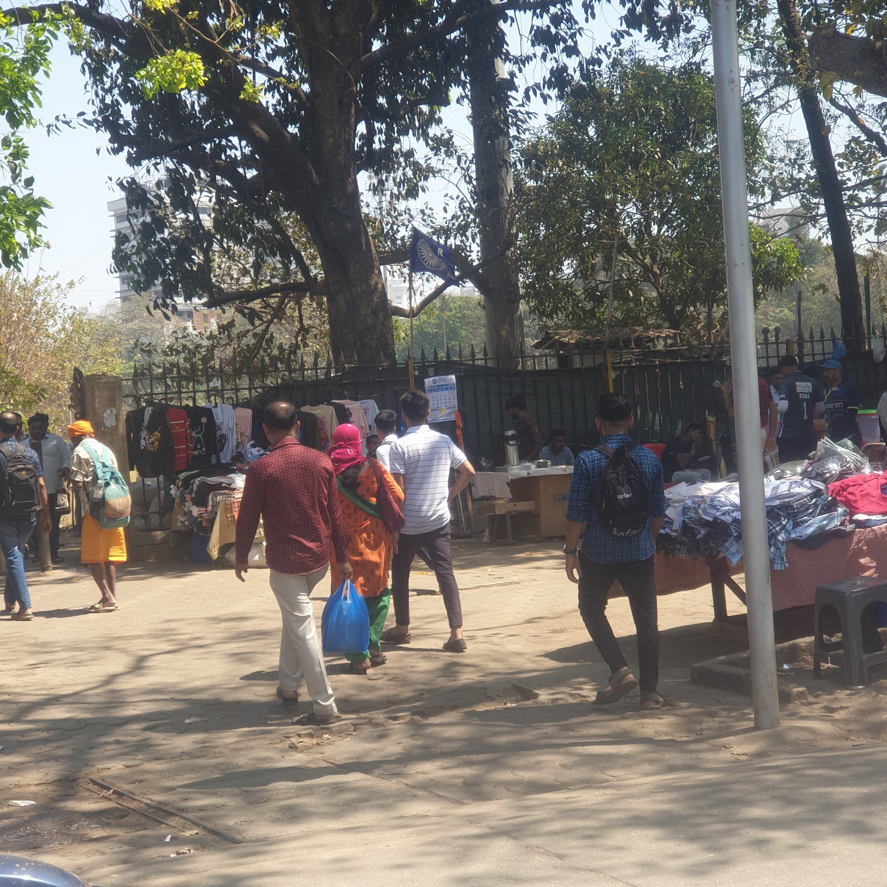 men walking though a busy marketplace
