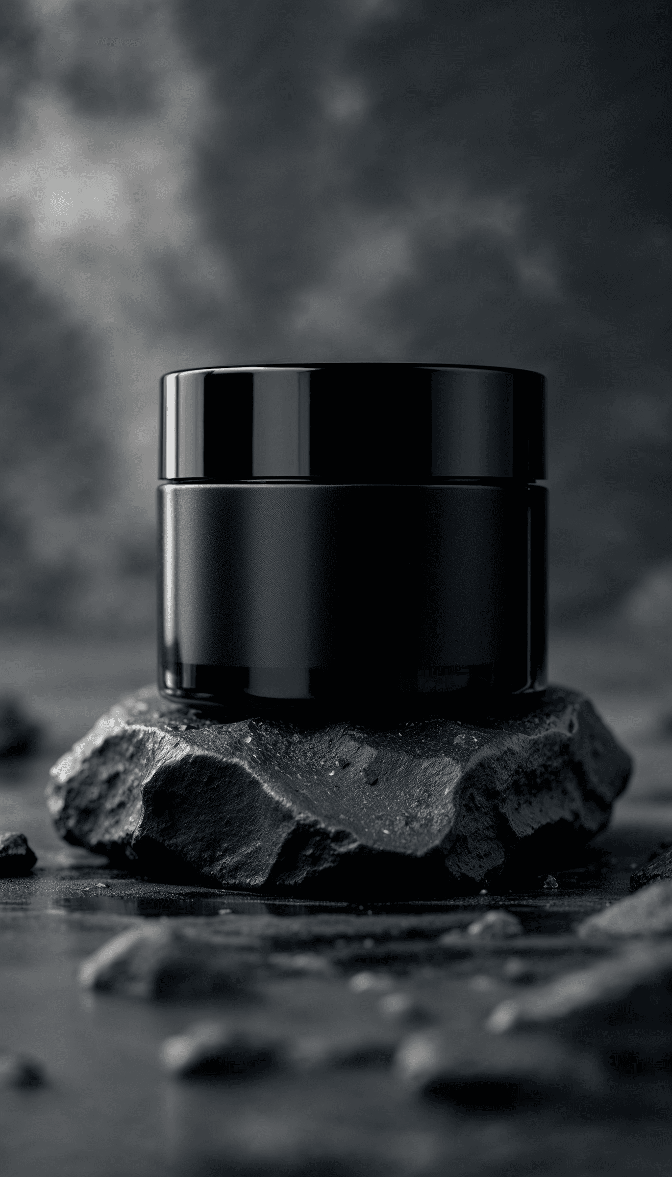 Close-up of black jar over textured rocks