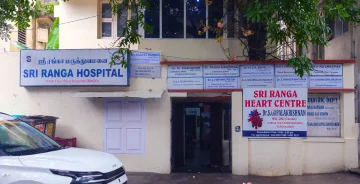 This is the cream color two floor outpatient block of sri ranga hospital where general medicine, orthopedics, pediatrics, laboratory, neuro psychiatry, xray are consulted