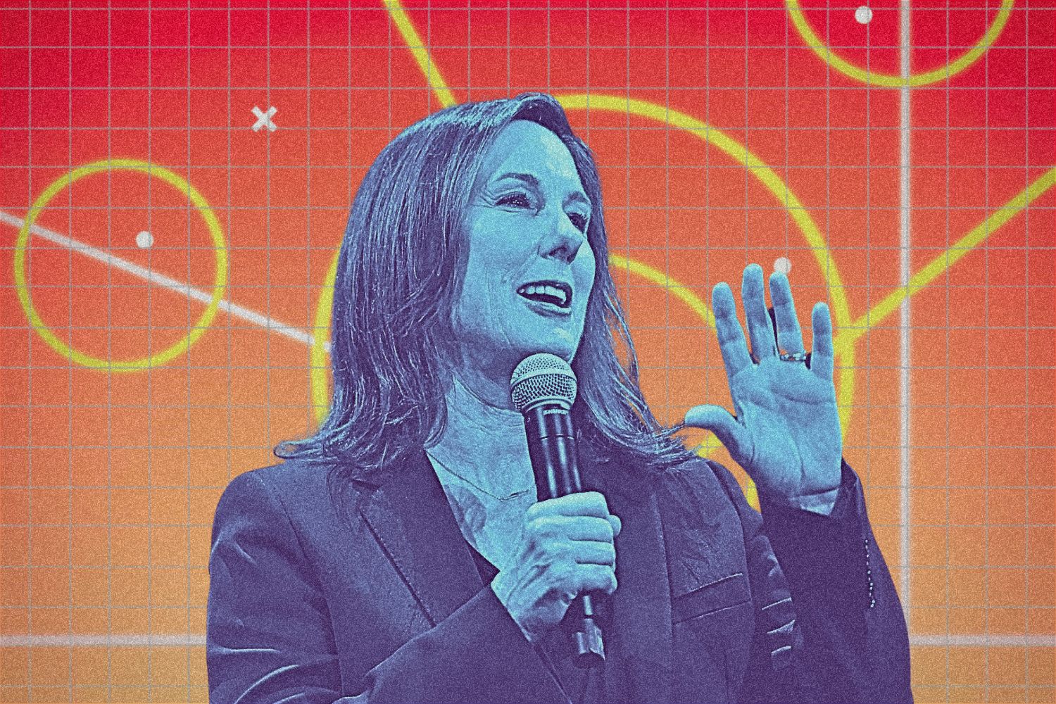 Lucasfilm president Kathleen Kennedy with a microphone speaking. She has a blue tint and is in front of an ombre colored background