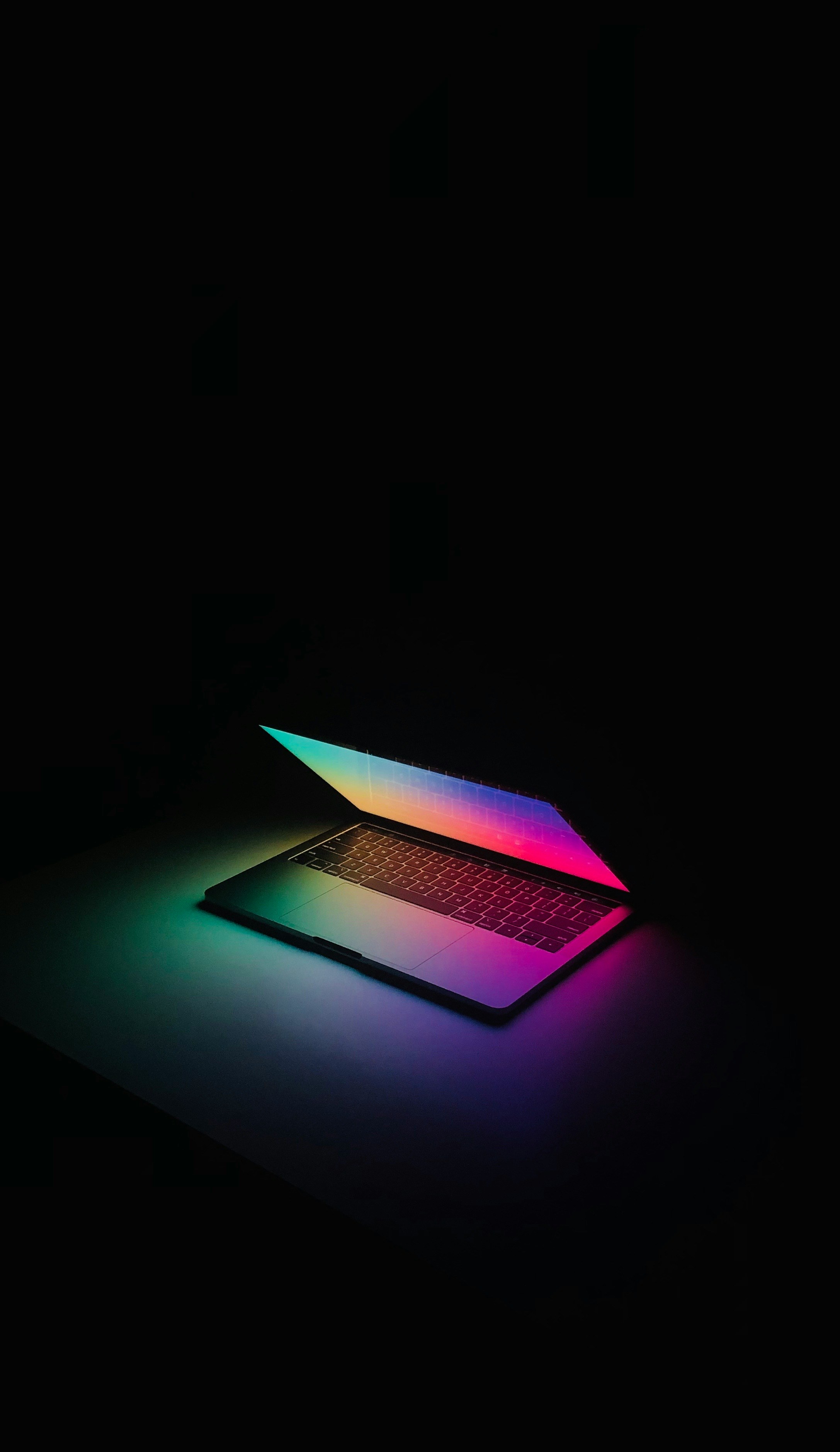 a laptop computer sitting on top of a table
