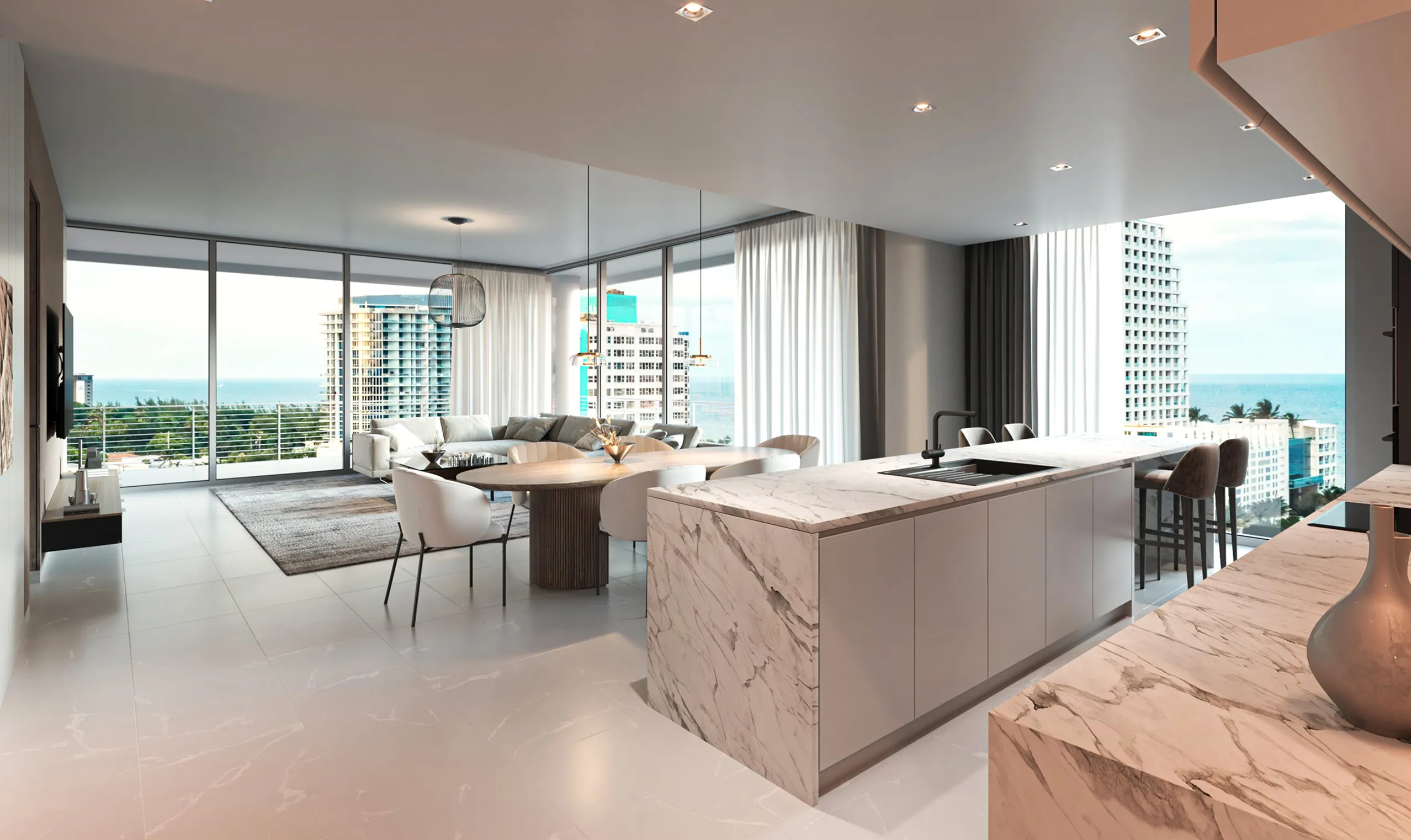Stylish kitchen and living room area showcasing a beautiful ocean view through large glass windows.